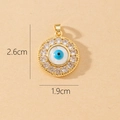 Macro view of evil eye pendant with cubic zirconia inlay measuring 2.6cm by 1.9cm - Gold Classic Blue and White Evil Eye Round Pendant (R)