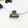 Detail shot of a dark green jelly-textured small hair claw clip in a glossy finish - Jelly Mini Claw - Semi-circle Olive Green