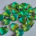 Green and yellow gradient heart stone pendants with metal clasp on white background - Yellow Blue Glass
