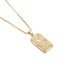 Macro shot of gold rectangle pendant featuring heart lock and key with zircon inlay - Heart Lock & Key Box Chain