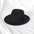Macro shot of the black fedora felt hat featuring a classic grosgrain ribbon band and texture - 58cm (Adult) / Black