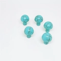 Five turquoise mushroom stones with natural black veins on a clean white background - Turquoise (Synthetic)