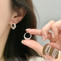 Triple-layered silver metal hoop earrings with elegant beaded texture shown on model - Silver Triple Beaded Hoop (ED2598)