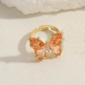Anello aperto dorato con ali di farfalla in zircone arancione e piccoli strass luminosi - Anello Farfalla in Zirconia