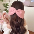 Elegant large pink matte satin bow hair clip for women styled in a soft half-up hairdo - Pink Simple Bow Duckbill Clip
