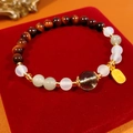 Macro detail of bead bracelet with tiger eye stones and a gold lucky charm tag - Exquisite Gift Box / Green Phantom Crystal & Tiger Eye (Wealth Charm)