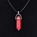 Polished red quartz hexagonal point pendant with black cord necklace on velvet - Red Jade