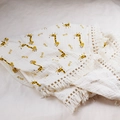 Detail of soft muslin baby blanket with giraffe print and decorative tassel edge - Custom Size / Giraffe