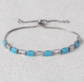 Macro detail of adjustable silver bracelet featuring alternating turquoise and zircon stones - Turquoise & White Zircon Silver