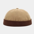 Detail showing the two-tone khaki and brown cotton twill fabric of the docker brimless cap - Khaki With Coffee Edge