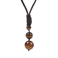 Detail of three tiger eye beads on a brown braided cord necklace against white backdrop - Necklace Only / Yellow Tiger Eye Necklace