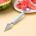Light blue dual-ended stainless steel fruit baller and carving knife on wood background - Nordic Blue