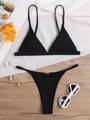 Flat lay of black ribbed bikini set with metal ring detail and summer beach accessories - S / 2-Piece Bikini Set / Black