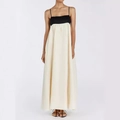 Detailed view of black and white contrast dress showing silky fabric texture and long hemline - XS / Tops / Apricot