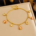 Close-up of gold ladybug bracelet with heart zirconia on a jewelry display box - Red Ladybug Heart Style (B1785)