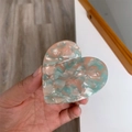 Detail of heart-shaped earphone case with pink and cyan marble texture finish - Marble / Pink Blue Claw