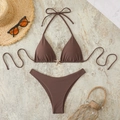 Detail van een bruine halterbikini met gouden zeester-accessoire op marmeren ondergrond - S / koffiekleur