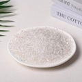 Natural clear crystal quartz raw stone chips displayed in a white ceramic dish - 100 Grams Of Ordinary White Crystal (3-5mm)