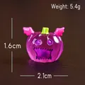 Miniature purple resin Halloween pumpkin with pink wings and 2.1cm width dimensions - Purple Pumpkin with Wings