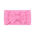 Soft nylon baby headband with a large pink bow, ultra-elastic hair accessory for infants - Coral Pink