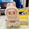 Pink rabbit costume outfit for Labubu doll with white knitted overalls and heart eyes - White Bear Bubble Overalls / First And Second Generation Keychains Are Compatible With La Cloth Dolls. Dolls Not Included.