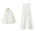 Dettaglio completo di set a due pezzi in maglia a costine bianca con collo a zip - Taglia unica / Bianco latte