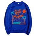 Blue Gulf of Mexico beach sunset hoodie with palm tree graphic and orange sun design - Blue