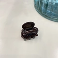 Close-up of small brown acetate hair claw clip with golden France Handmade logo - 2.6cm / Coffee