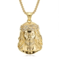 Macro shot of hip hop Jesus head pendant with sparkling rhinestones on thorn crown - Rhinestone Charm / Gold with Zirconia