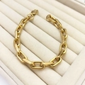 Detail view of a gold-plated stainless steel paperclip chain bracelet in a jewelry tray - Rectangular Paperclip Link / Gold