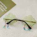 Close-up of cloud-shaped light green sunglasses with gold frame and blue teardrop charms - Light Grass Green