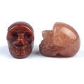 Hand-carved red jasper and strawberry quartz crystal skull statues for decor - Purple Aventurine