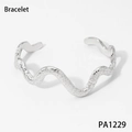 Modern wavy silver-colored bangle featuring a unique hammered texture on white background - Silver Wavy Bracelet (PA1229)
