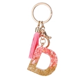 Llavero letra D de resina rosa con purpurina dorada, borla rosa y anillo de metal - Pan de Oro Rosa D