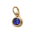 Close-up of a 6mm faceted blue birthstone pendant in a gold-plated stainless steel frame - [Jump Ring] September Sapphire Blue