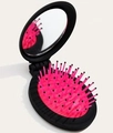 Portable folding hair brush with black shell, pink bristles and built-in mirror - Girls Black Oval Folding Mirror Brush
