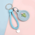 Light blue leather key ring with cactus pattern and woven handle on pastel background - Hand Strap Style - Cactus