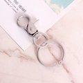 Gray painted metal lobster clasp keychain with round ring on marble background - Light Gray