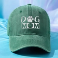 Close-up of white DOG MOM embroidery on green washed cotton baseball cap texture - One Size / Dark Green