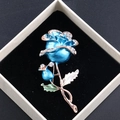 Elegant blue enamel rose brooch with white rhinestones on black gift box lining - Blue Rose Rhinestone