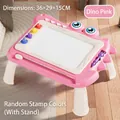 Pink dinosaur themed magnetic drawing board table for kids with four stamps and a purple pen - Large Dinosaur Themed Board With Legs - Pink