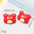 Detailed view of red resin crab charms with dimensions 2.1cm width and 1.7cm height - Red Crab