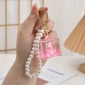 Pink liquid sand cube keychain with cute pig figurine and white pearl pendant - Chain Style-Glitter Orange