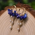 Golden hoop earrings with natural blue lapis lazuli and white pearls on wood - Lapis Lazuli Tassel Earrings