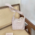 Floral canvas shoulder bucket bag in pastel pink and green tones on a rattan chair - Pink Floral