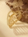 Close-up of golden metal hollow heart hair claw on natural rock and sand background - Style 2-Hollow Chain Heart / Gold