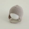 Detail of beige knit baby hat showing soft texture and ear flaps with chin straps - 3-15 Months / Gray