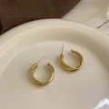 Detail view of gold matte triple C-shaped hoop earrings on a ceramic dish - 14# Gold Triple Wrapped C-Shape Earrings (14# Silver Earring Post-Matte-Geometric)