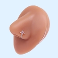 Close-up of a silver cross nose stud with pink heart stone on a realistic nose model - Silver Heart Cross Pink Gemstone (#16)