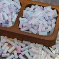 Macro shot of 6x12mm pink and blue gradient glass bamboo tube beads in a wooden tray - Pink Blue Gradient (J115#)